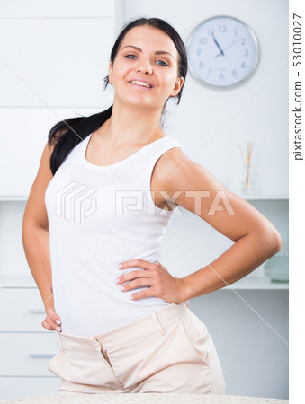 Young brunette woman in white 53010027