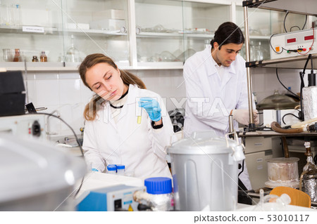 Female chemist writing results of experiments Female chemist writing results of experiments 53010117