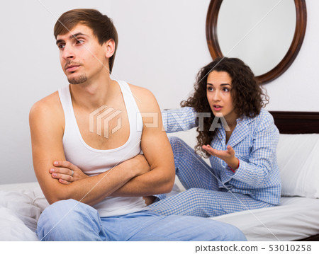 Couple sorting out relationships in bed 53010258