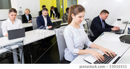 Business people working in coworking space Business people working in coworking space 53010331