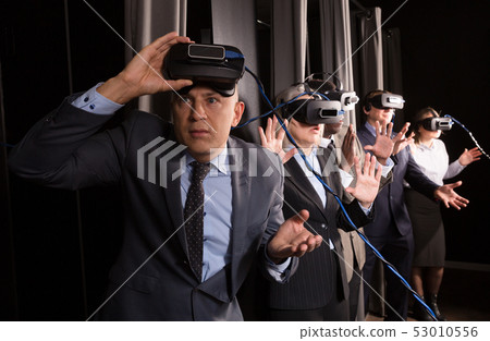 Man wearing virtual reality glasses 53010556