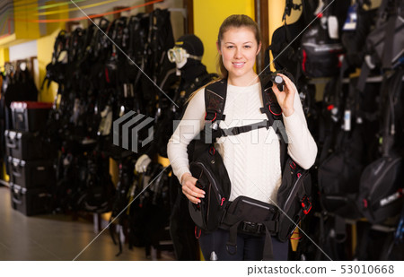 Woman is standing in new equipment for diving Woman is standing in new equipment for diving 53010668