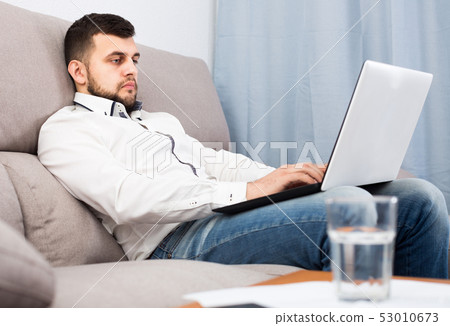 Depressed young male spending day alone Depressed young male spending day alone 53010673