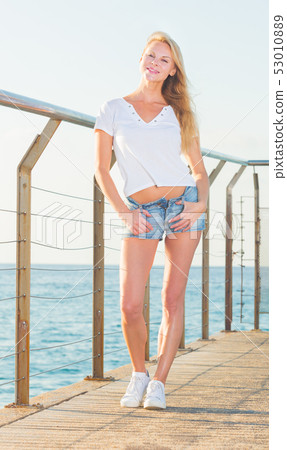 Active female is posing on pirce Active female is posing on pirce 53010889