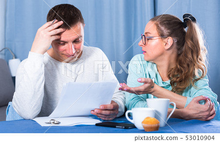 Couple struggling to pay bills Couple struggling to pay bills 53010904