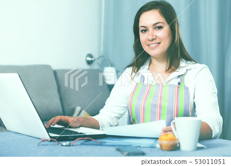 Housewife searching for recipes 53011051