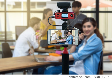 Closeup smart mobile phone taking Live of Businesswoman working with Group Of Business people, Camera for photographer or Video and Live Streaming concept Closeup smart mobile phone taking Live of Businesswoman working with Group Of Business people, Camera for photographer or Video and Live Streaming concept 53011206