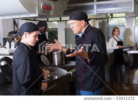 Chef dissatisfied with work of girl 53011372