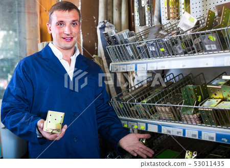 workman holding metal furniture workman holding metal furniture 53011435