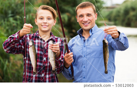 Boy and man fishing 53012003