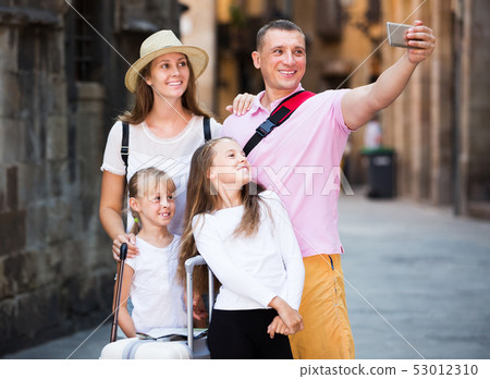 Travelers family taking selfie 53012310