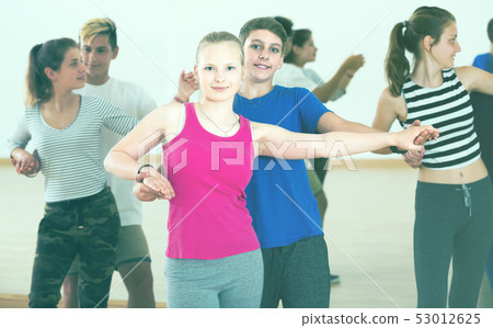 Group of teen dancing salsa in dance studio 53012625