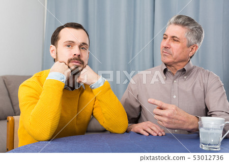 Mature father and son serious talk Mature father and son serious talk 53012736