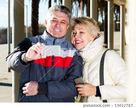 Mature couple doing selfie Mature couple doing selfie 53012787