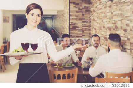 Professional nippy at table of senior customers Professional nippy at table of senior customers 53012921