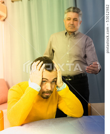 Adult father teaches his son Adult father teaches his son 53012982