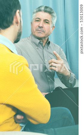 Adult father and son solve problems Adult father and son solve problems 53013009