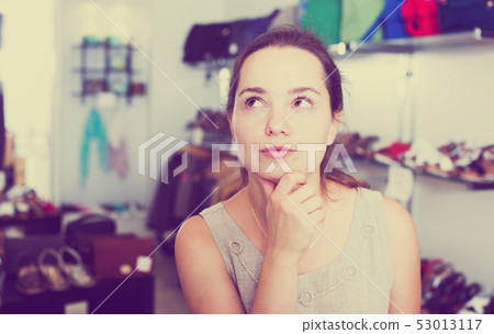 Female customer in shoes center 53013117