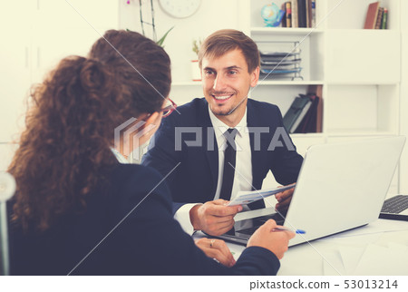 Business male assistant wearing formalwear using laptop 53013214