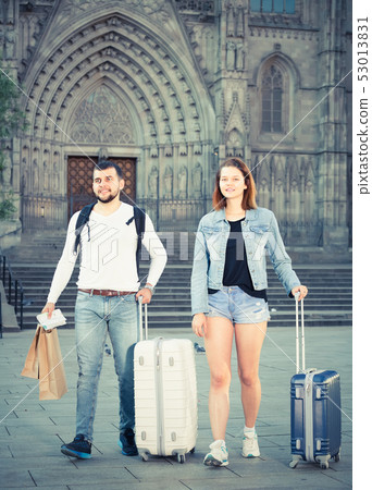 Attractive couple going the historic city center Attractive couple going the historic city center 53013831
