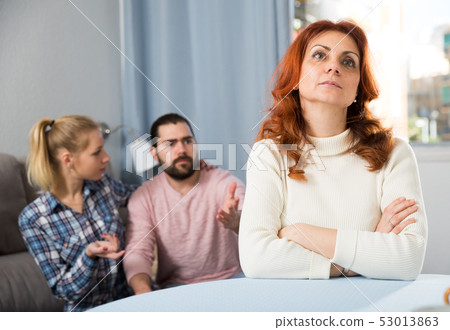 Young serious couple has a family stressful conversation at home Young serious couple has a family stressful conversation at home 53013863