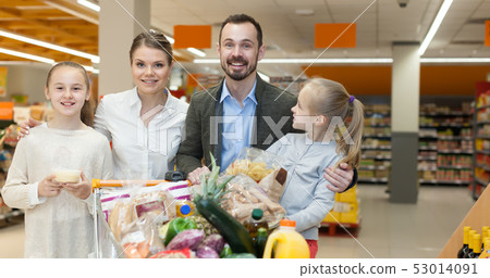 Friendly children and parents with purchases Friendly children and parents with purchases 53014091