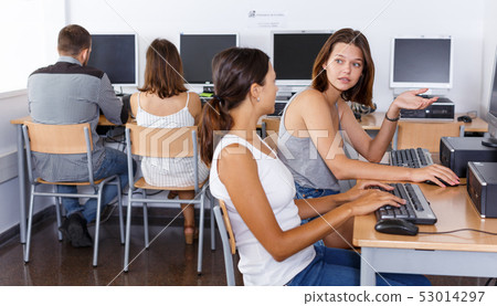 Female students studying in computer class Female students studying in computer class 53014297