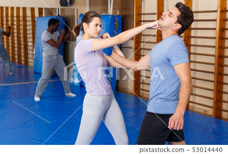 People practicing self defense techniques 53014440