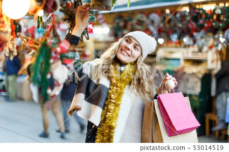Cheerful girl at Christmas fair Cheerful girl at Christmas fair 53014519