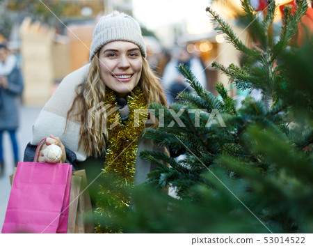 Woman buying Christmas tree Woman buying Christmas tree 53014522
