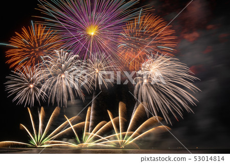 Fantastic Multicolor Firework exploding for Celebration from the big boat over the sea, celebration and happy new year and merry christmas concept 53014814