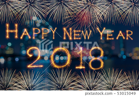 Happy new year 2018 written with Sparkle firework on fireworks with dark background, celebration and greeting cards concept Happy new year 2018 written with Sparkle firework on fireworks with dark background, celebration and greeting cards concept 53015049