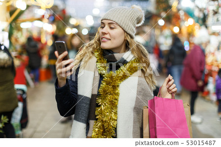 Woman making picture at Christmas fair Woman making picture at Christmas fair 53015487