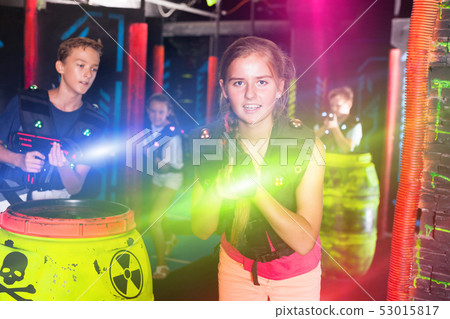 Girl playing laser tag 53015817