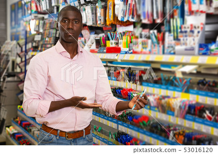 male customer choosing new pen male customer choosing new pen 53016120