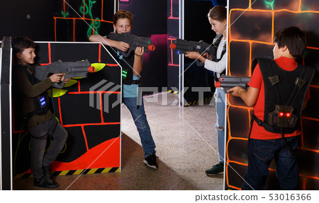 Positive kids aiming laser guns at other players 53016366