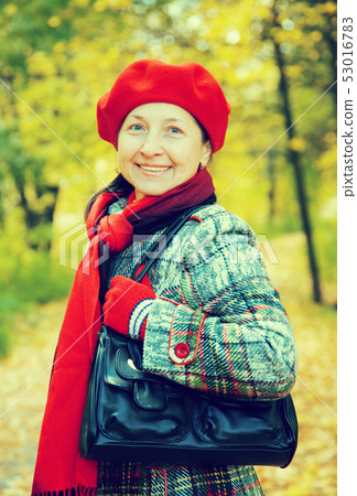 woman in autumn park woman in autumn park 53016783