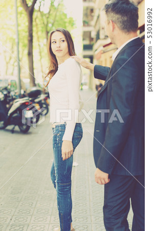 Woman smiling back to stranger 53016992