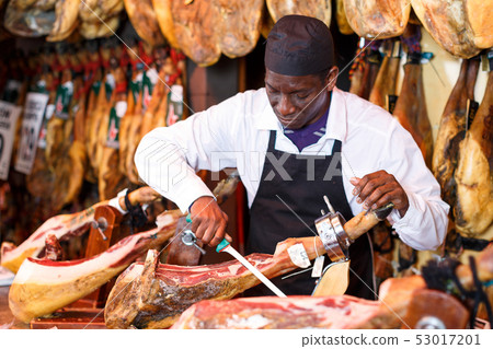 Salesman cutting ham for sale Salesman cutting ham for sale 53017201