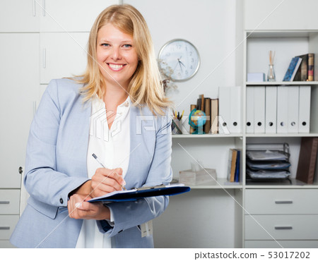 Portrait of businesswoman with folder 53017202