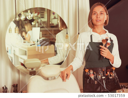 Smiling adult woman professional makeup artist 53017359