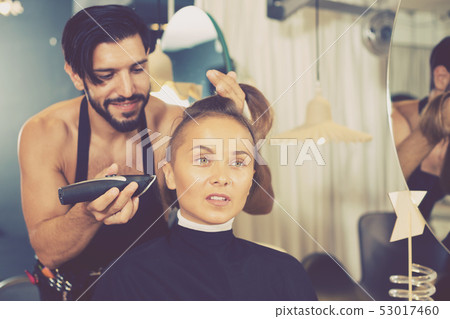 hairdresser working with hair clipper hairdresser working with hair clipper 53017460