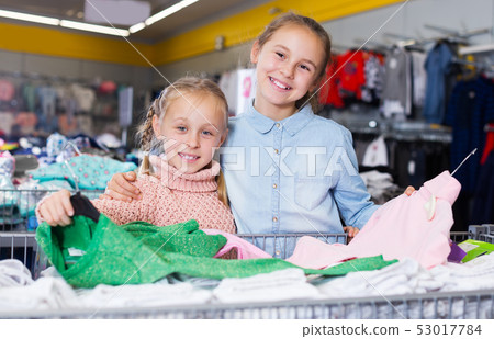 two little girls with new clothes two little girls with new clothes 53017784