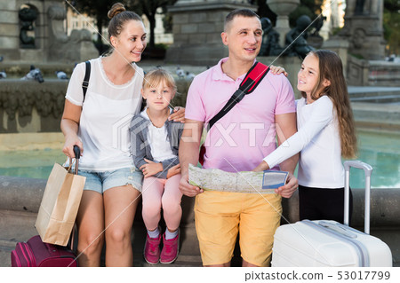 parents with two kids traveling together searching location on paper map parents with two kids traveling together searching location on paper map 53017799