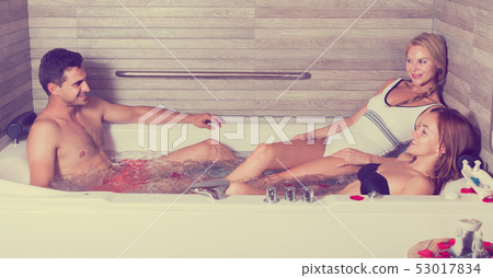 Man with two girlfriends are enjoying of relax Man with two girlfriends are enjoying of relax 53017834