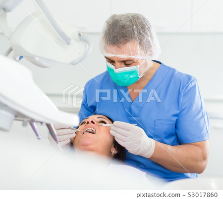 dentist professional filling teeth 53017860