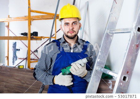 Male worker is ready to work with a dril Male worker is ready to work with a dril 53017871