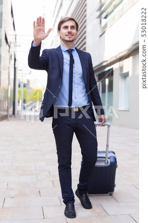 Portrait of cheerful male going with bag Portrait of cheerful male going with bag 53018222