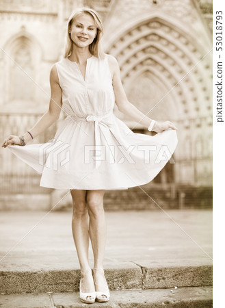 Positive female walking at the street 53018793