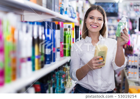 Girl shopping hair care treatments 53019254
